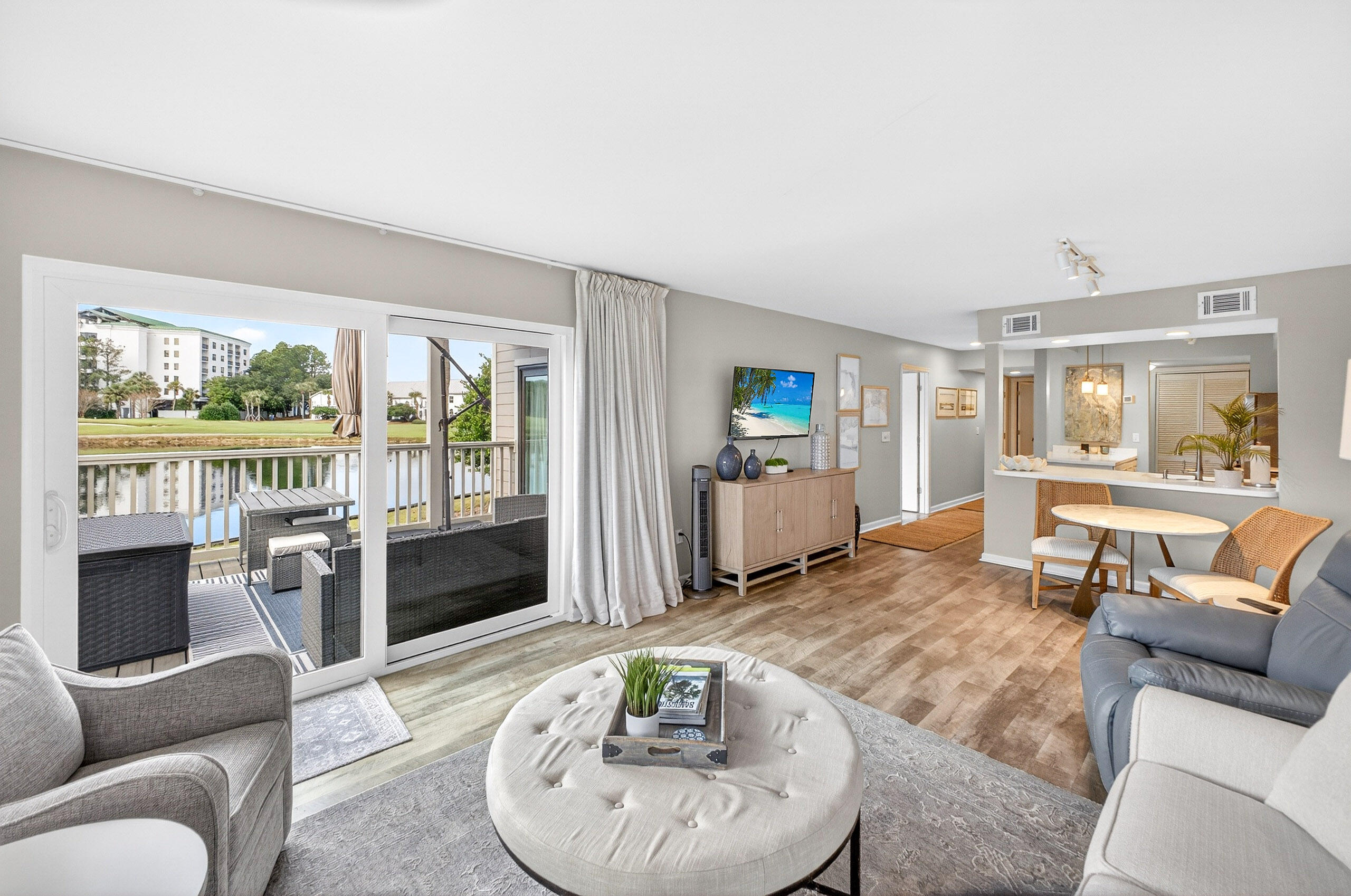 900 Harbour Point Lane, Unit 900 Miramar Beach, FL 32550 - Photo 1 of 64 a living room with furniture and a wooden floor