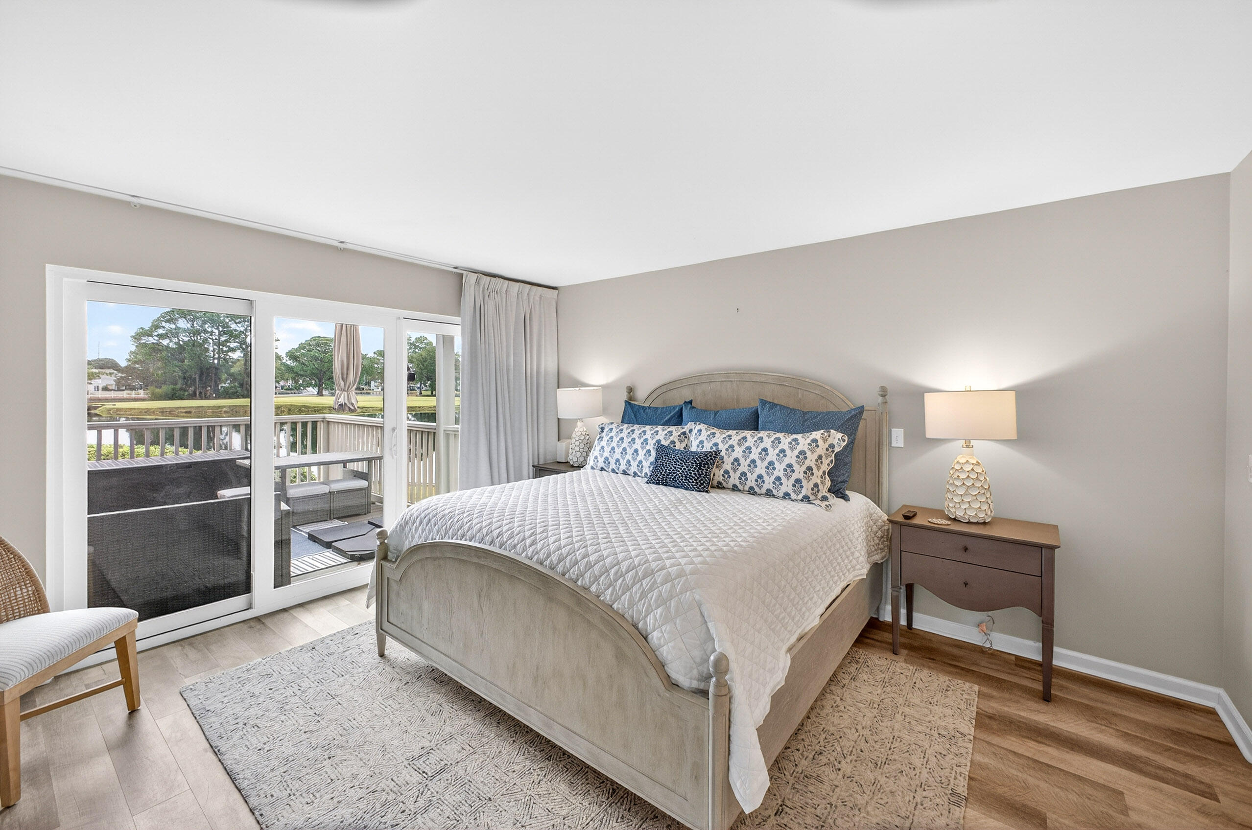 900 Harbour Point Lane, Unit 900 Miramar Beach, FL 32550 - Photo 17 of 64 a bedroom with a bed and a lamp with window