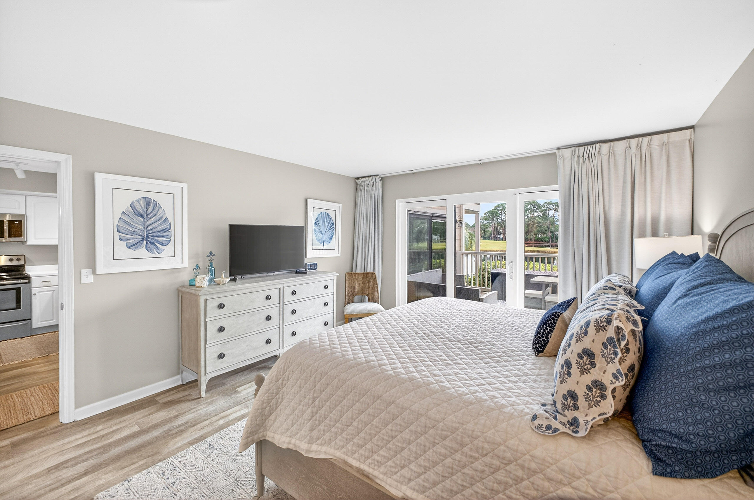 900 Harbour Point Lane, Unit 900 Miramar Beach, FL 32550 - Photo 18 of 64 a spacious bedroom with a bed and a flat screen tv