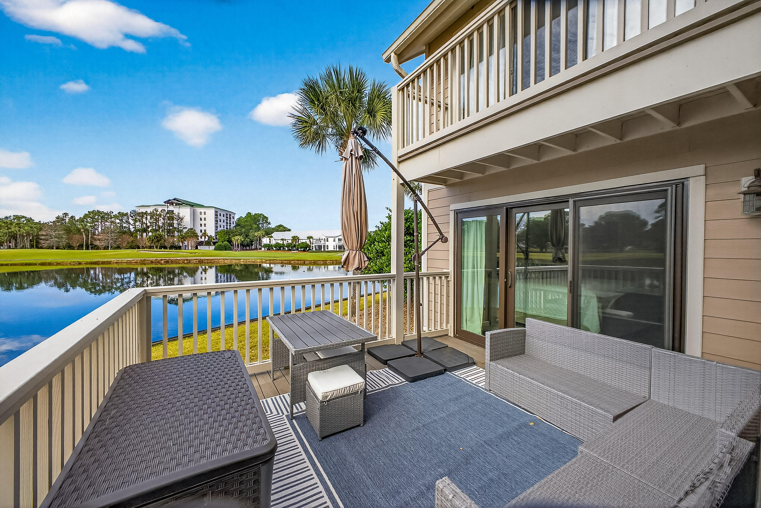 900 Harbour Point Lane, Unit 900 Miramar Beach, FL 32550 - Photo 2 of 64 a balcony with view of swimming pool