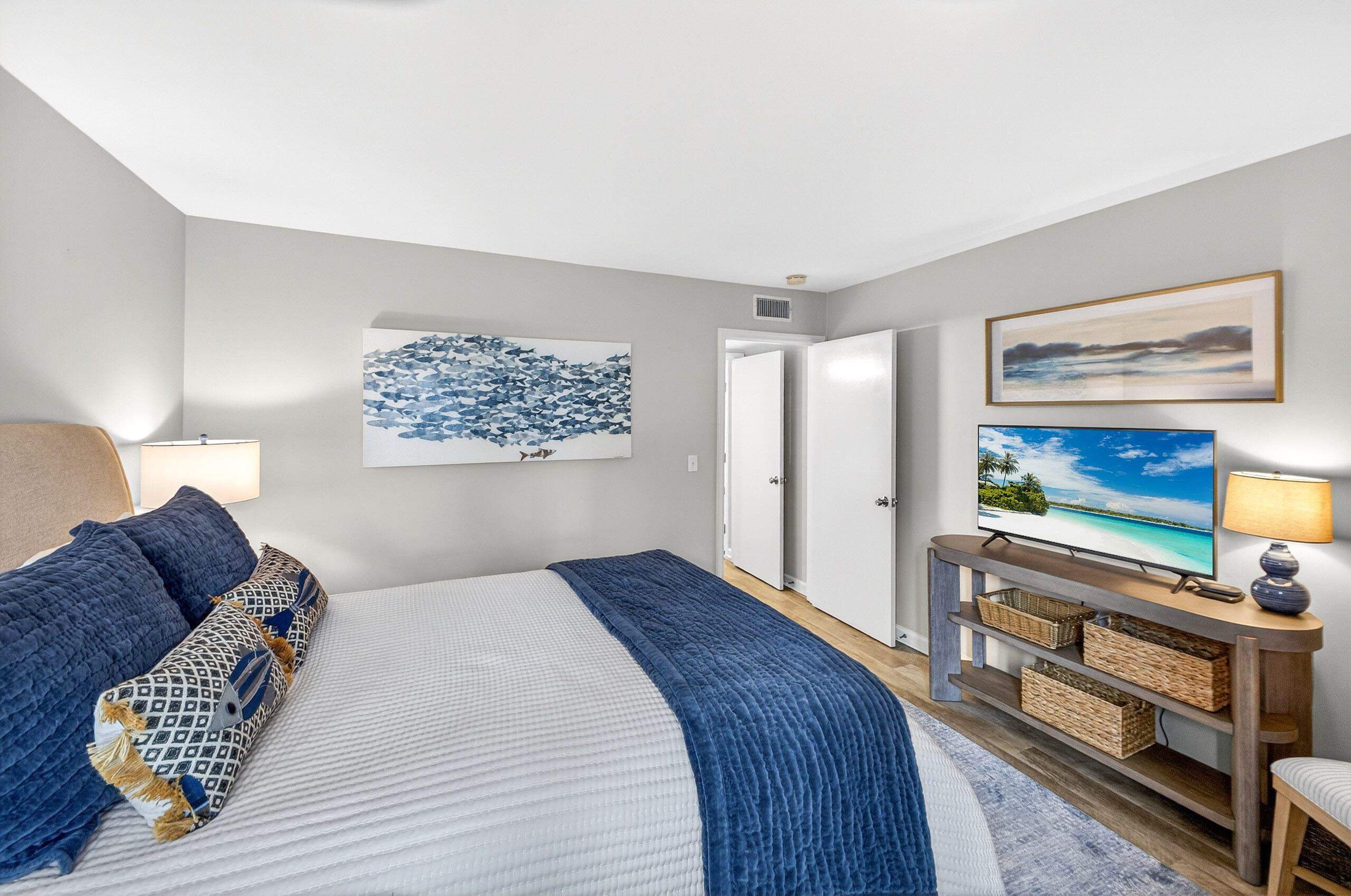 900 Harbour Point Lane, Unit 900 Miramar Beach, FL 32550 - Photo 28 of 64 a bedroom with a bed and a flat screen tv