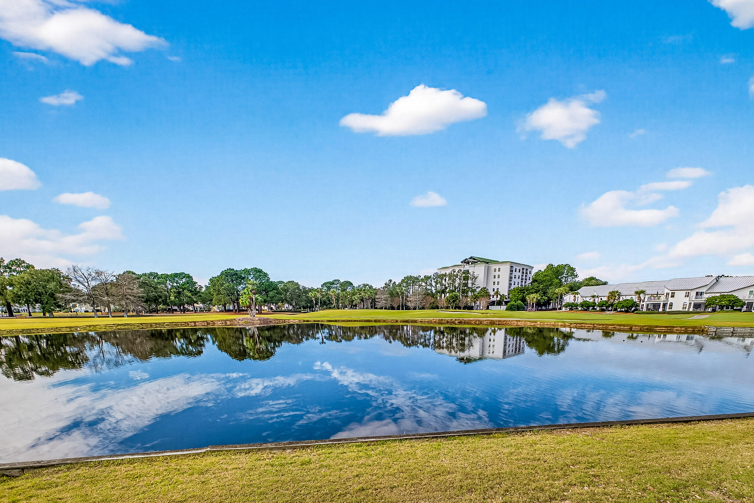 900 Harbour Point Lane, Unit 900 Miramar Beach, FL 32550 - Photo 32 of 64 a view of a lake with houses in the background