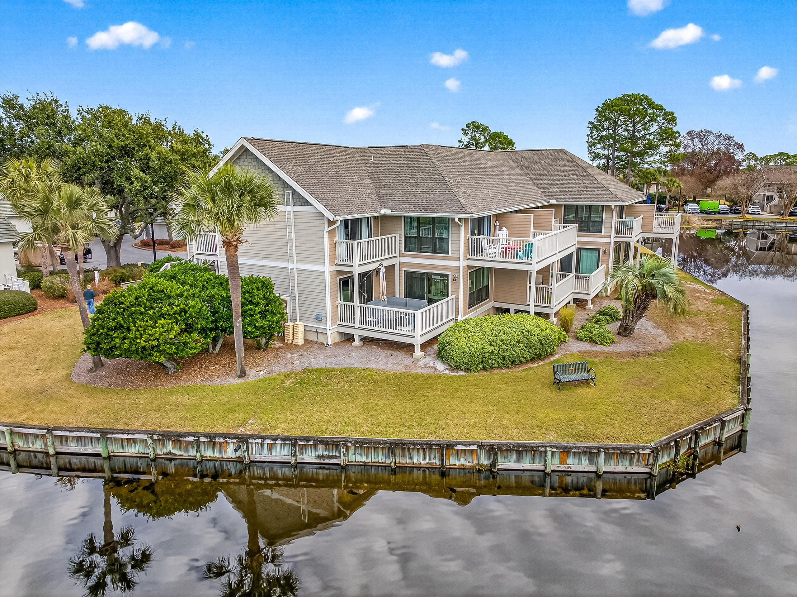 900 Harbour Point Lane, Unit 900 Miramar Beach, FL 32550 - Photo 38 of 64 a view of a house with pool and chairs
