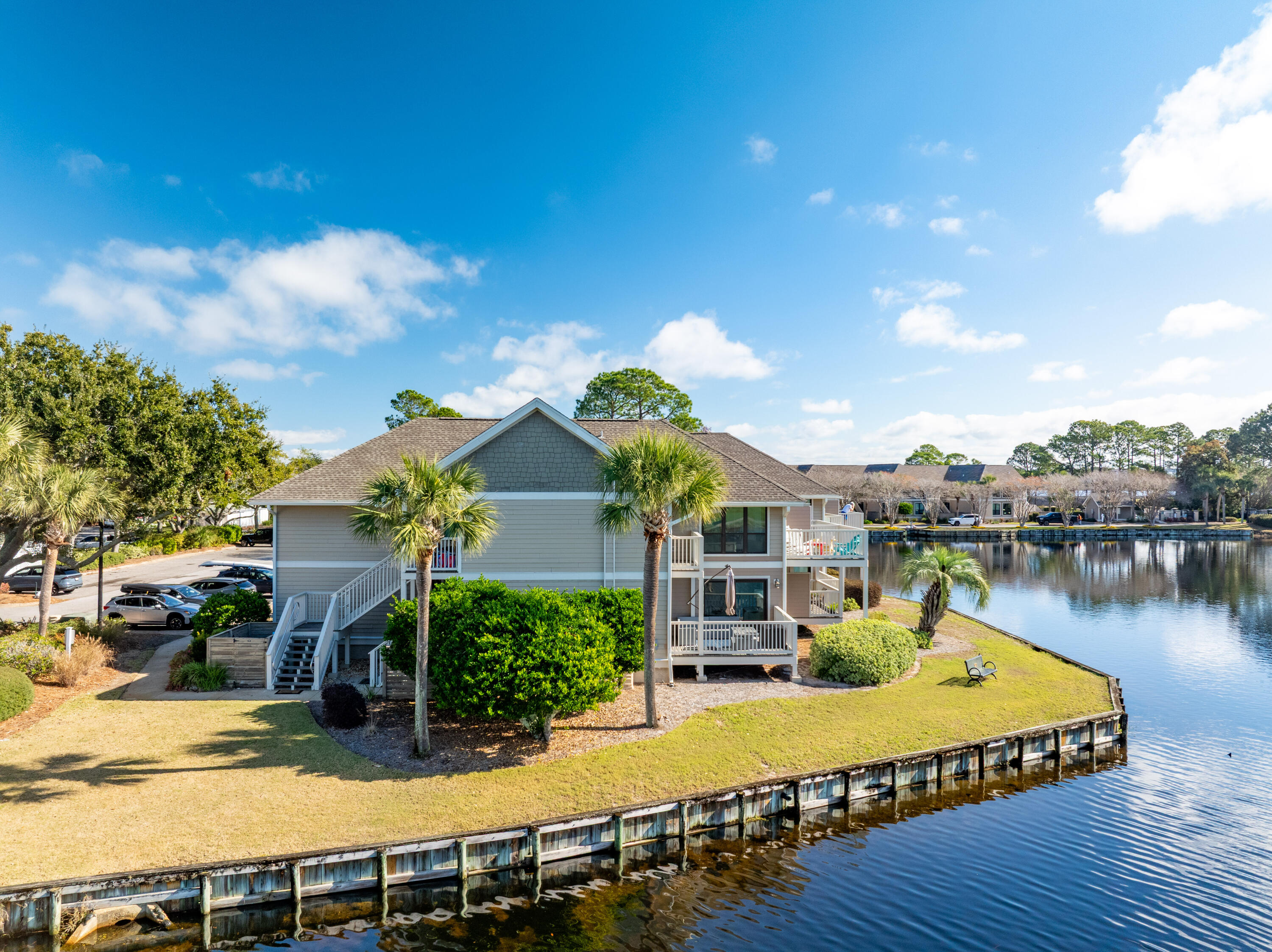 900 Harbour Point Lane, Unit 900 Miramar Beach, FL 32550 - Photo 39 of 64 a view of a house with pool and chairs