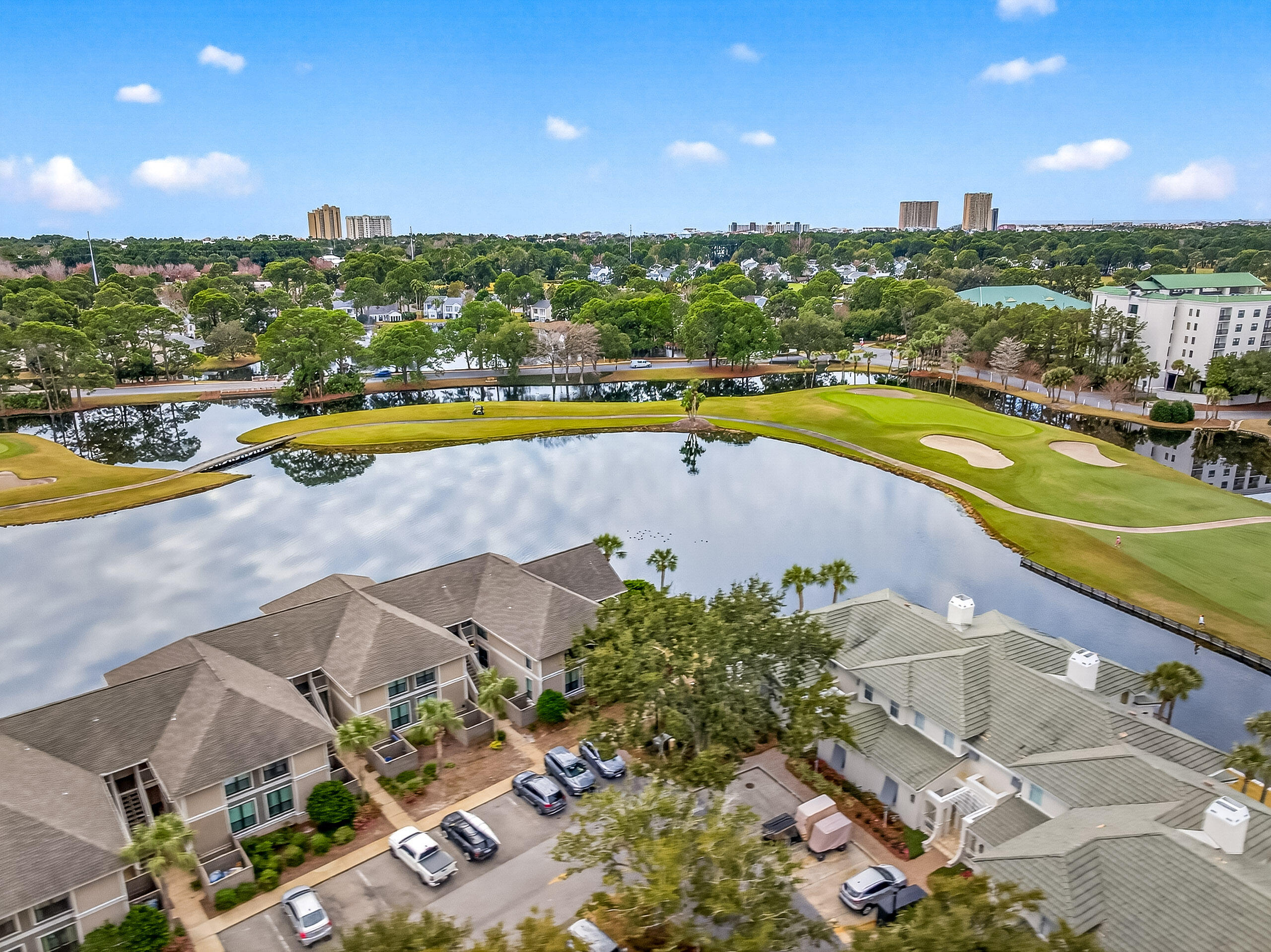 900 Harbour Point Lane, Unit 900 Miramar Beach, FL 32550 - Photo 41 of 64 an aerial view of a house with a swimming pool and outdoor seating