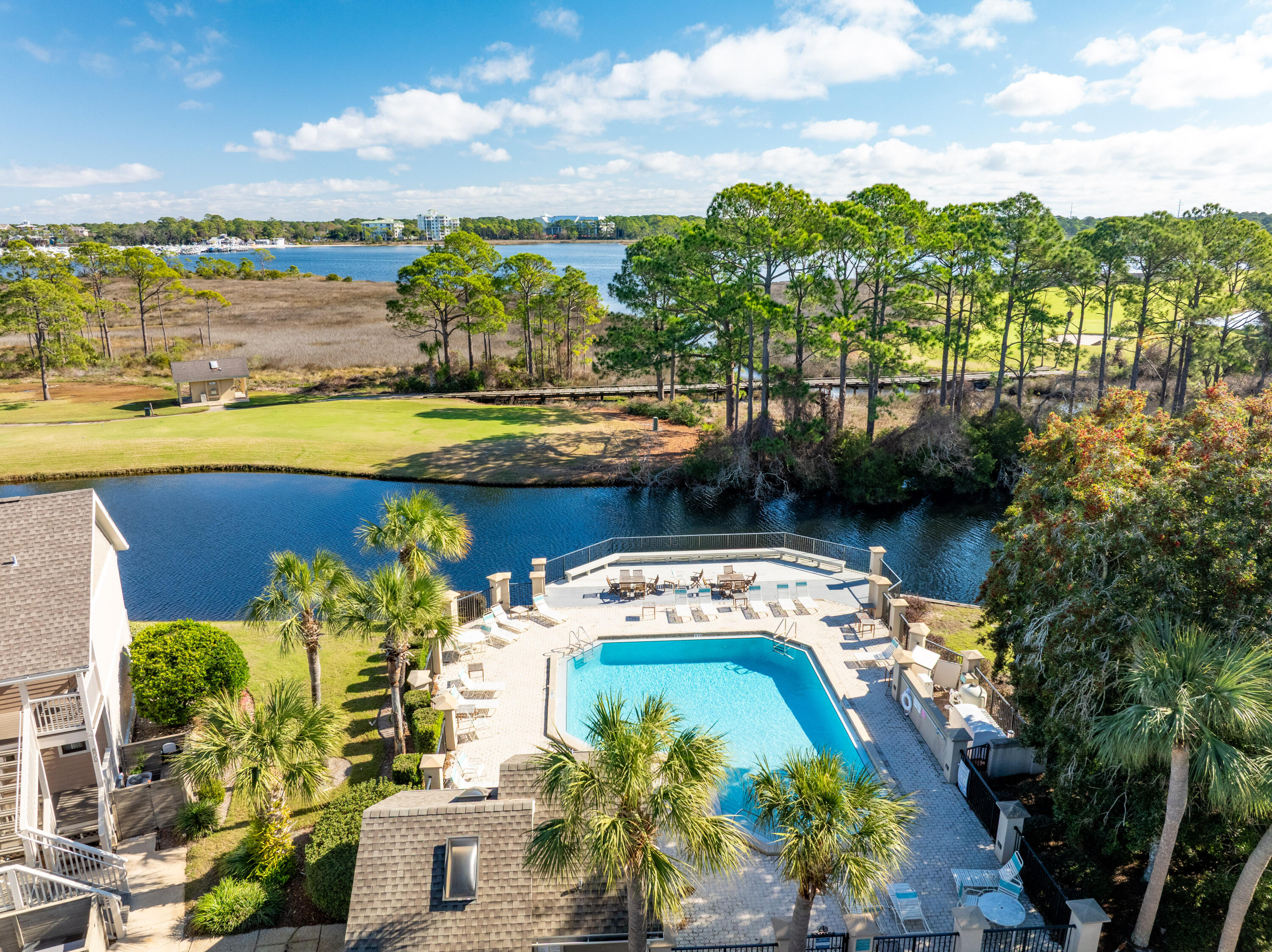 900 Harbour Point Lane, Unit 900 Miramar Beach, FL 32550 - Photo 44 of 64 a view of a swimming pool with a patio