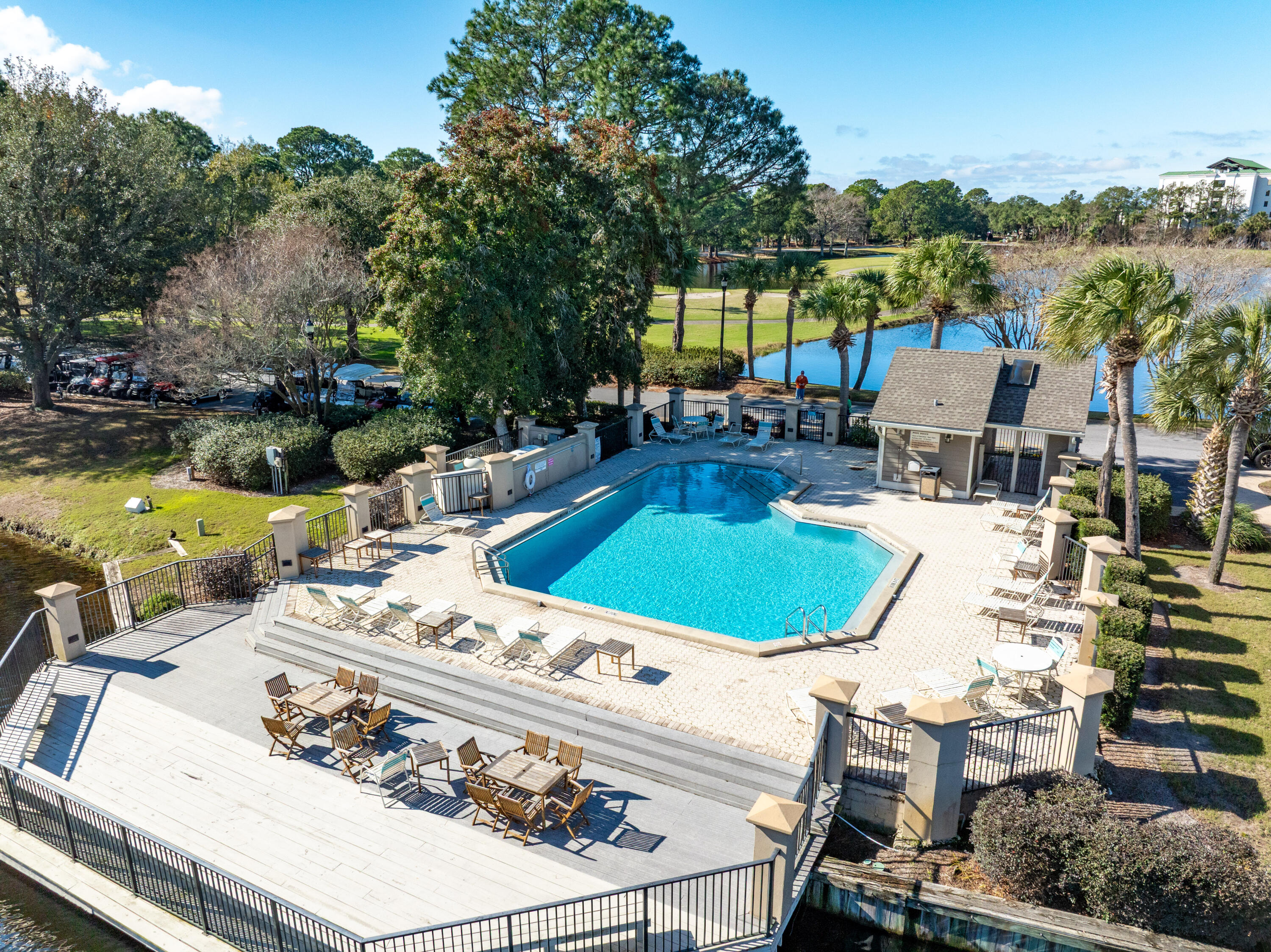 900 Harbour Point Lane, Unit 900 Miramar Beach, FL 32550 - Photo 46 of 64 a view of a swimming pool with lounge chairs