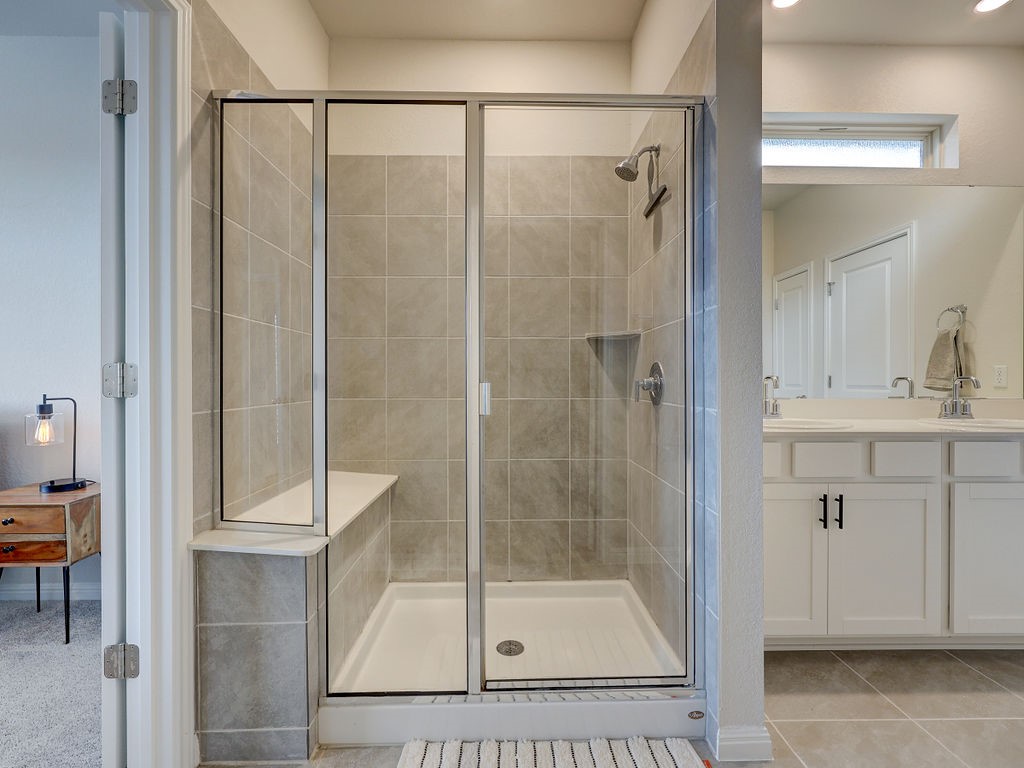325 Serpens Street Georgetown, TX 78628 - Photo 18 of 40 Walk in, tiled shower in primary bath