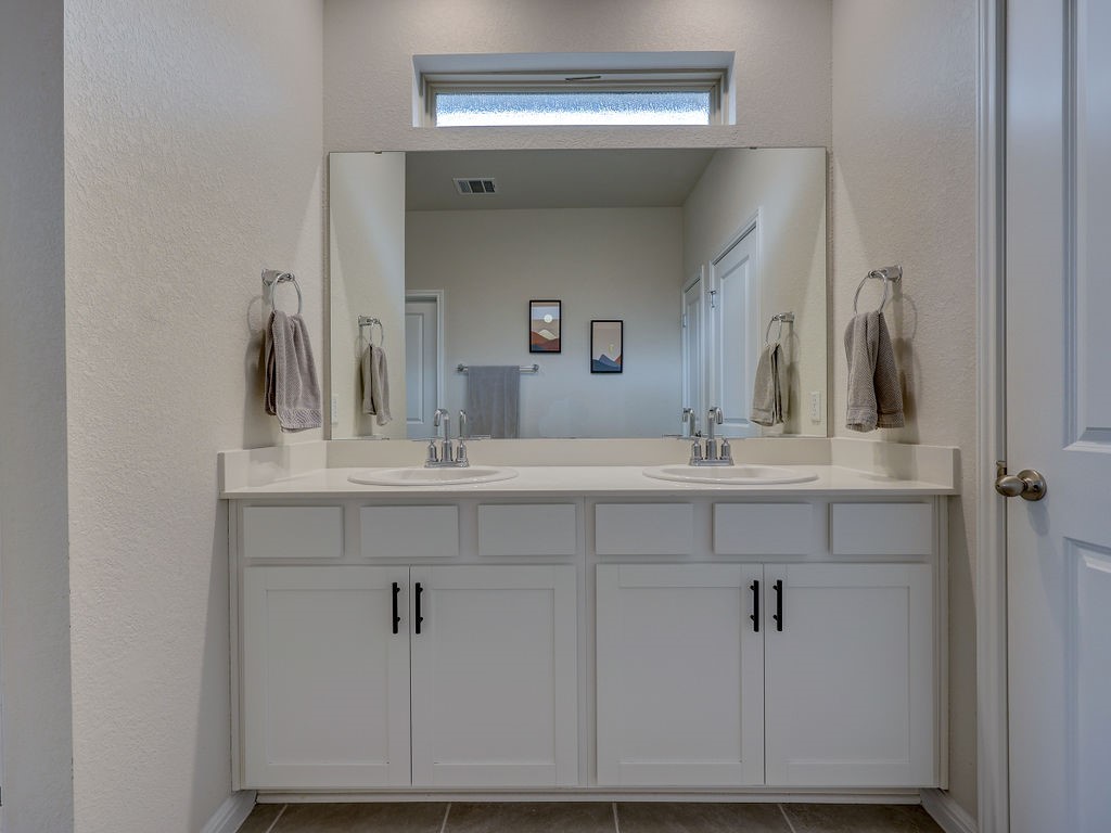 325 Serpens Street Georgetown, TX 78628 - Photo 19 of 40 Double vanity in primary bath