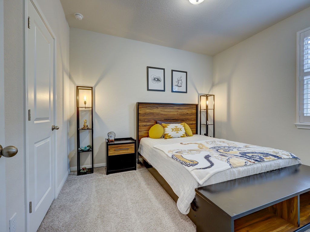 325 Serpens Street Georgetown, TX 78628 - Photo 20 of 40 Bedroom 2 has walk in closet