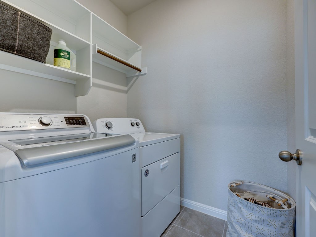 325 Serpens Street Georgetown, TX 78628 - Photo 24 of 40 Utility room has built in shelving, hanging rod - Washer and Dryer stay for tenant