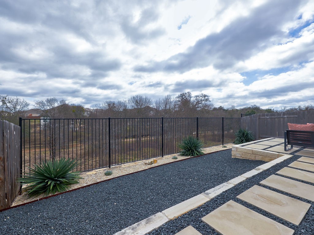 325 Serpens Street Georgetown, TX 78628 - Photo 28 of 40 Enjoy nature in the greenspace this home backs to