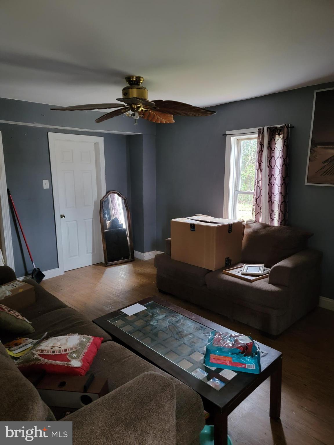 493 West Elmer Road Vineland, NJ 08360 - Photo 2 of 9 a living room with furniture and a wooden floor