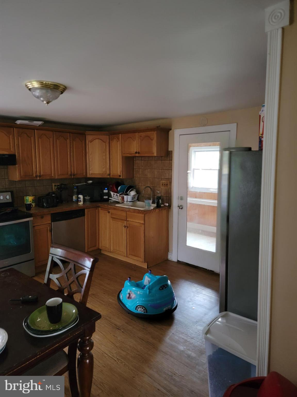 493 West Elmer Road Vineland, NJ 08360 - Photo 4 of 9 a kitchen with stainless steel appliances granite countertop a sink a stove and a refrigerator