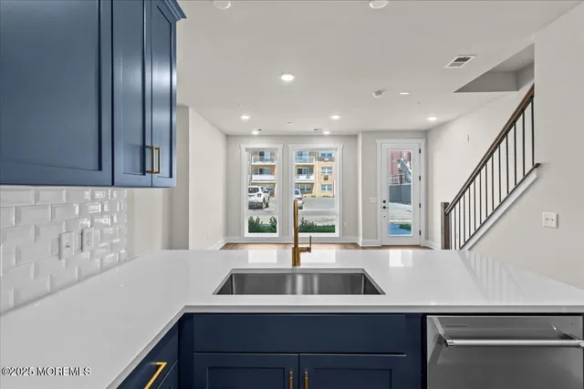 a kitchen with a sink and a window