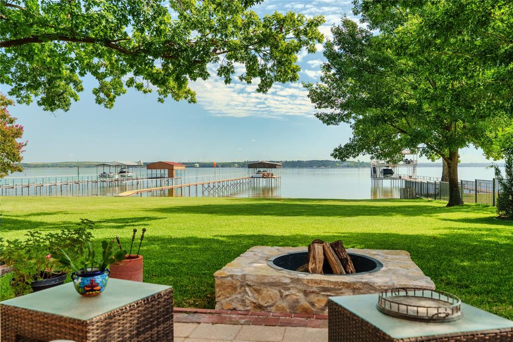 218 North Broadway Azle, TX 76020 - Photo 9 of 40 Patio view of firepit and lake