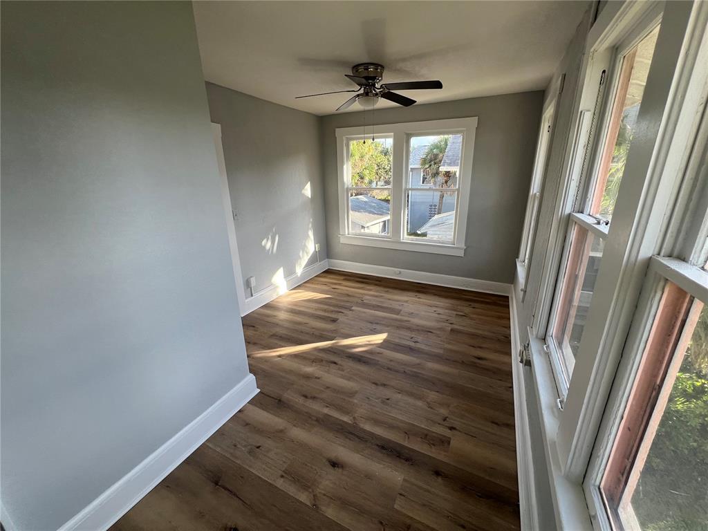 713 Davis Street, Unit 2 Daytona Beach, FL 32118 - Photo 5 of 10 a view of an empty room with a window