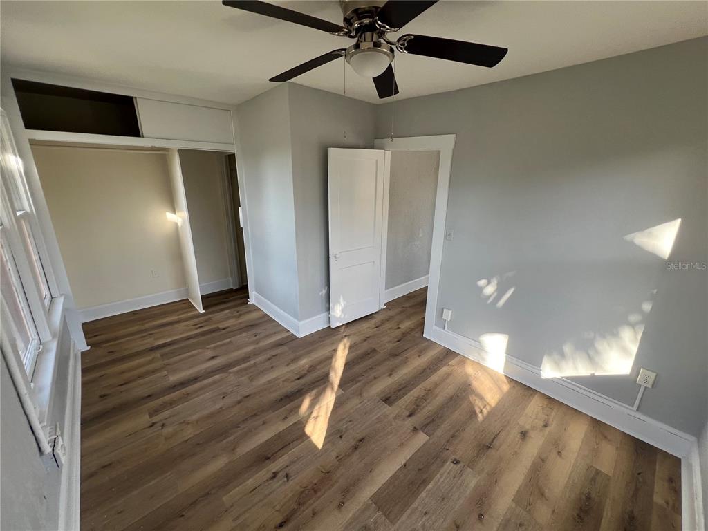 713 Davis Street, Unit 2 Daytona Beach, FL 32118 - Photo 6 of 10 a view of a hallway with wooden floor