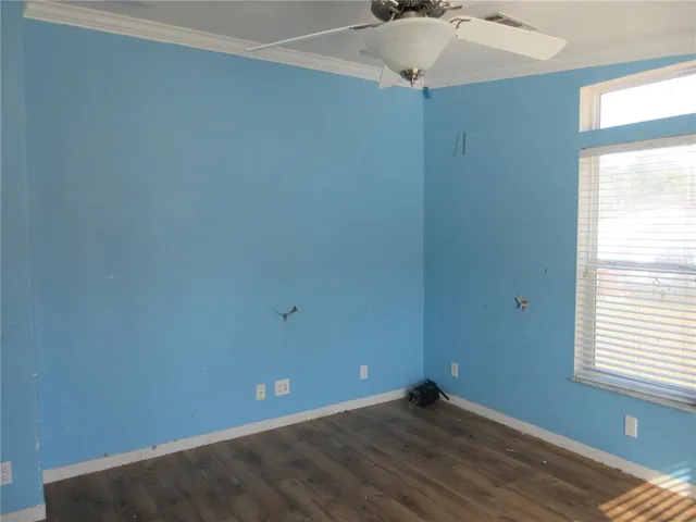 a view of a chandelier fan and entryway