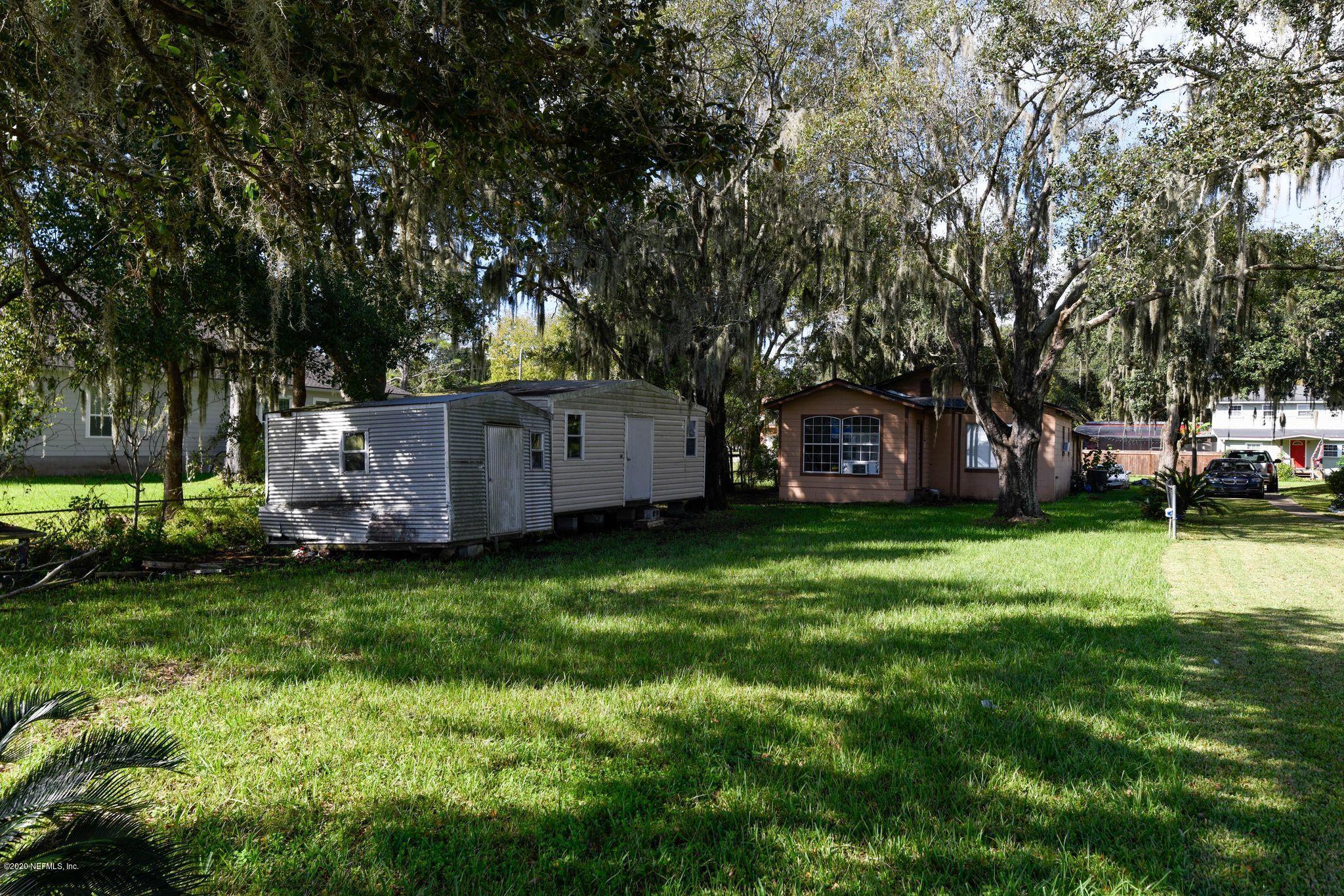 259 Brickyard Road, Unit C Middleburg, FL 32068 - Photo 4 of 17 a view of a backyard with large trees