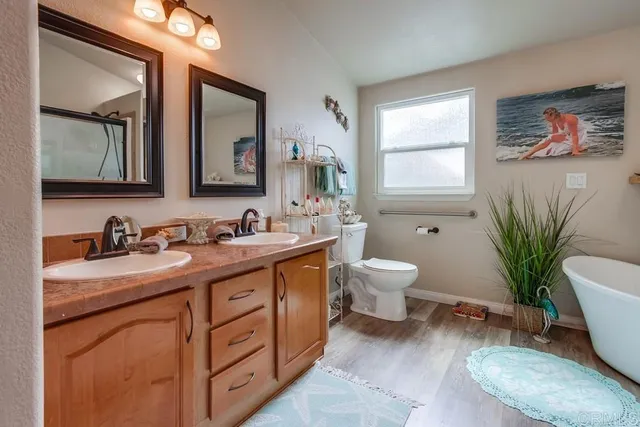 a white bath tub sitting in a bathroom