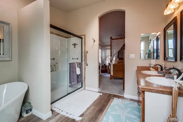 a bathroom with a toilet a sink and a mirror