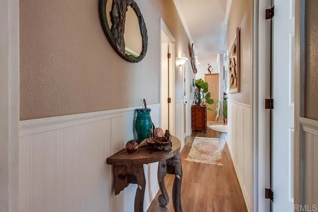a living room with furniture a window and a flat screen tv