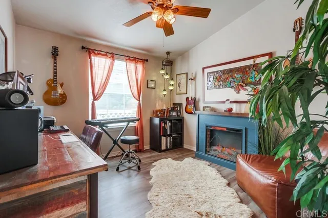 a blue bench sitting in front of a building