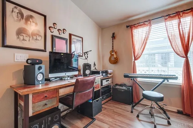 a bedroom with furniture and a window