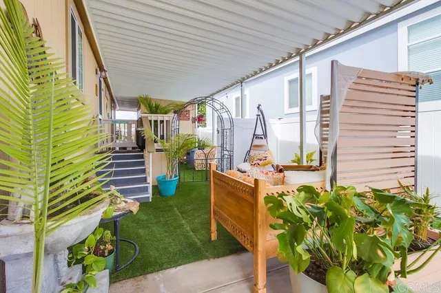 a front view of a house with outdoor seating