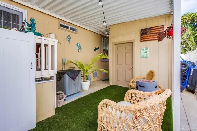 a view of a swimming pool with outdoor seating