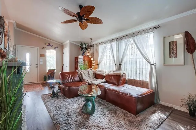 a bedroom with furniture and a flat screen tv