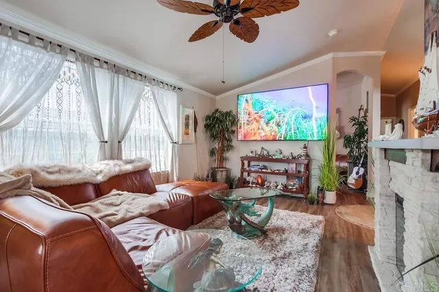 a living room with furniture and a fireplace