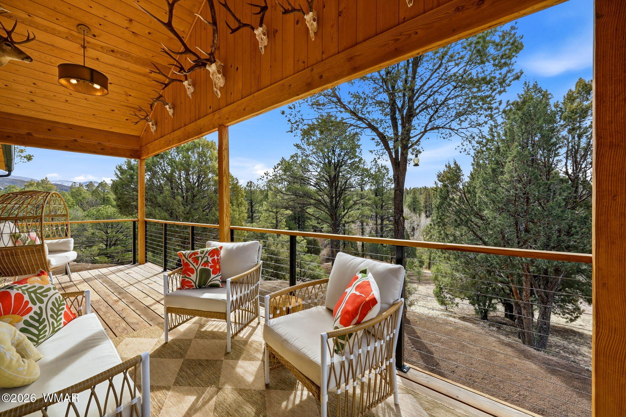 15 Co Road Nutrioso, AZ 85932 - Photo 13 of 46 a roof deck with couch and chairs