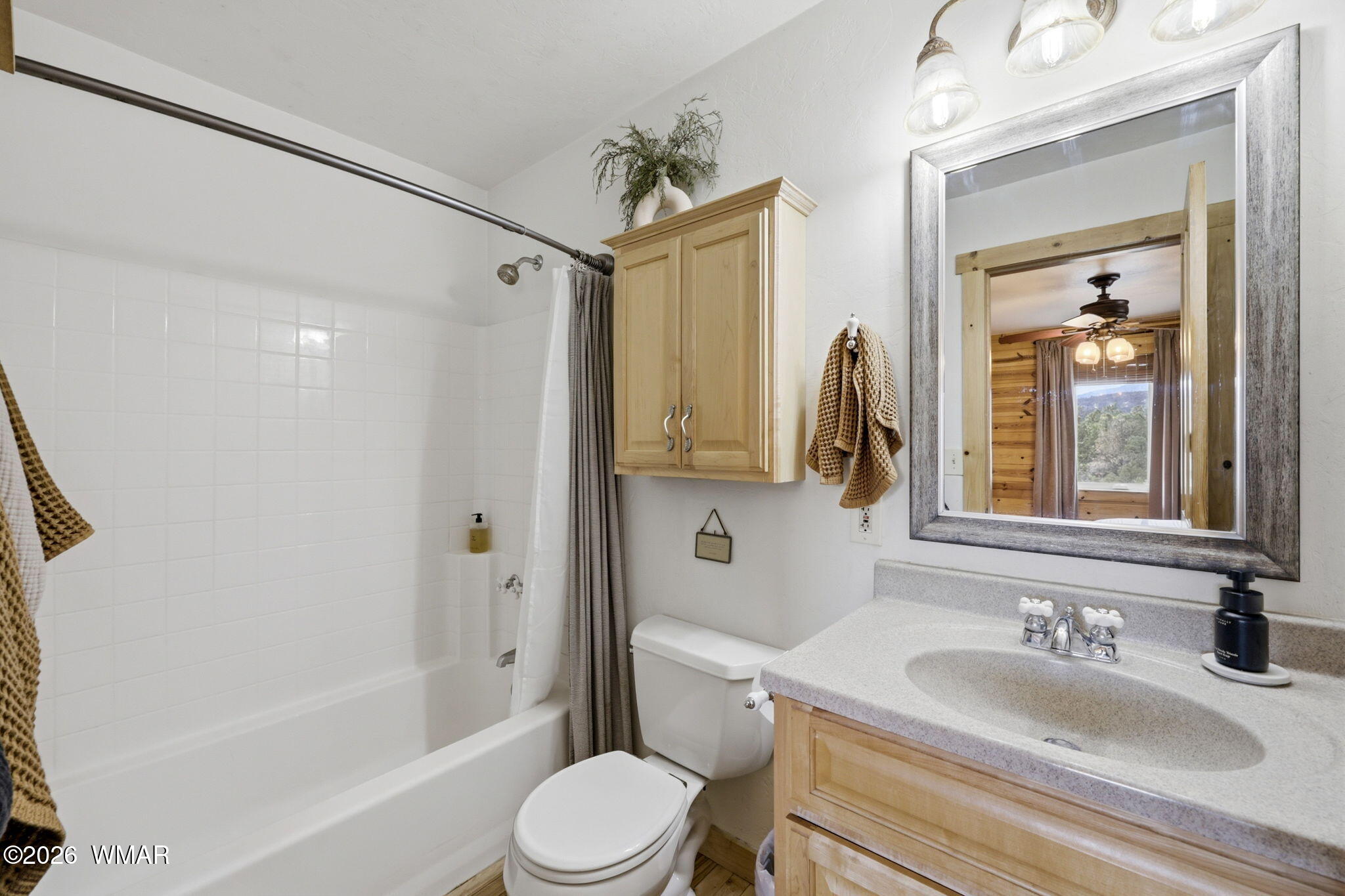 15 Co Road Nutrioso, AZ 85932 - Photo 24 of 46 a bathroom with a toilet sink vanity tub and shower