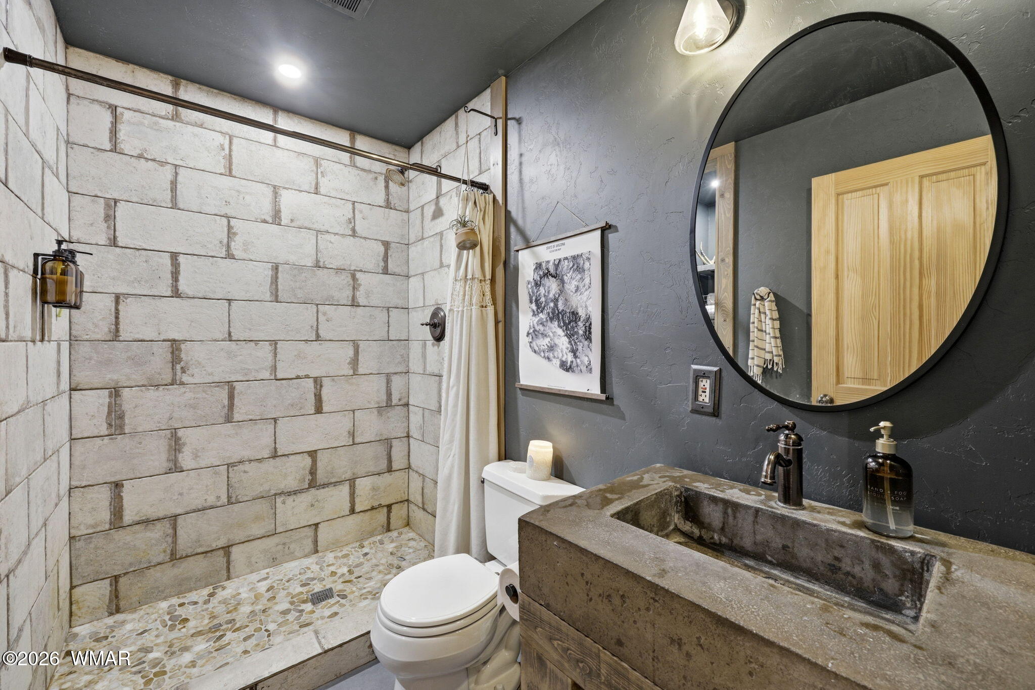 15 Co Road Nutrioso, AZ 85932 - Photo 27 of 46 a bathroom with a sink a toilet and a mirror