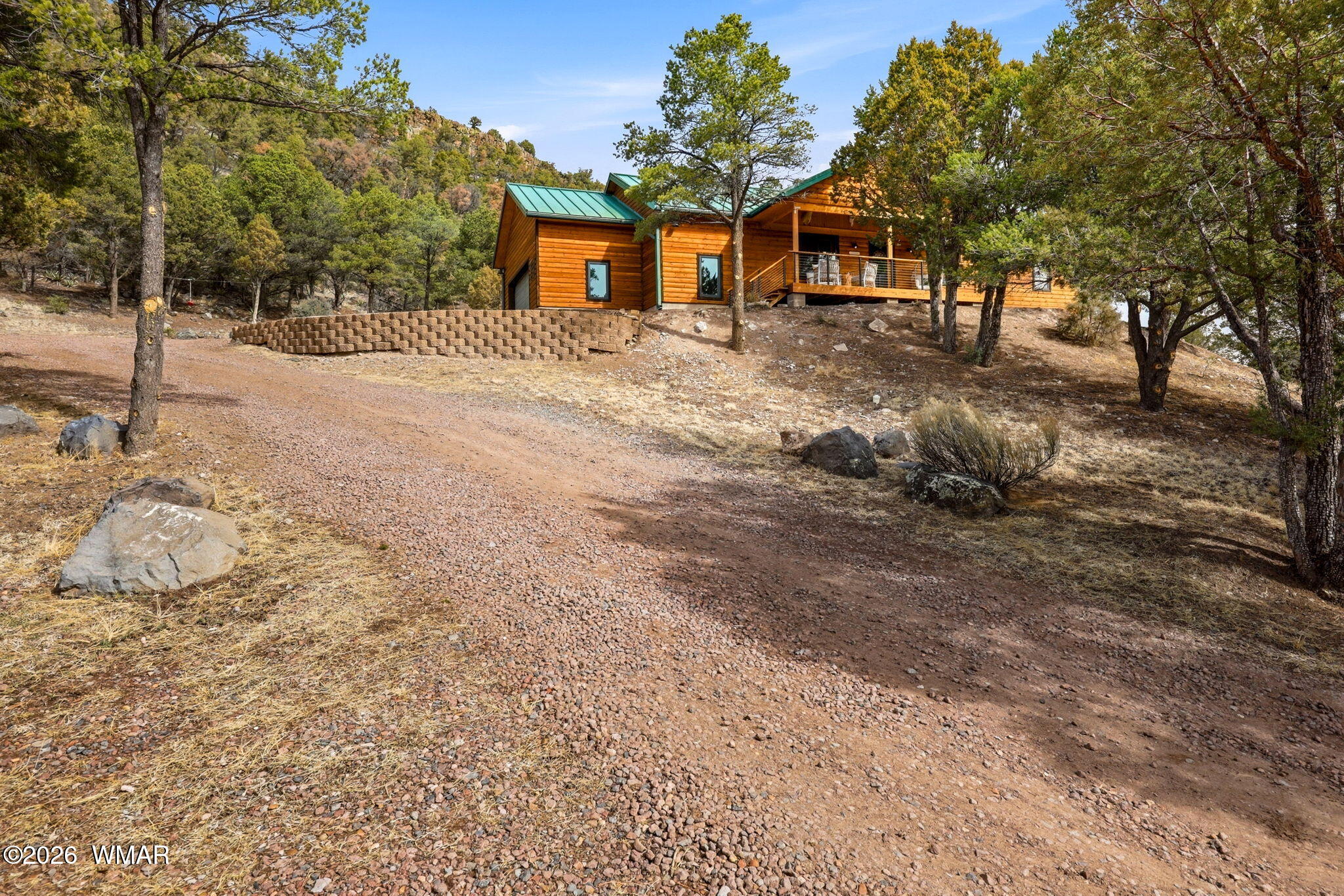 15 Co Road Nutrioso, AZ 85932 - Photo 9 of 46 a front view of a house with a yard covered in snow
