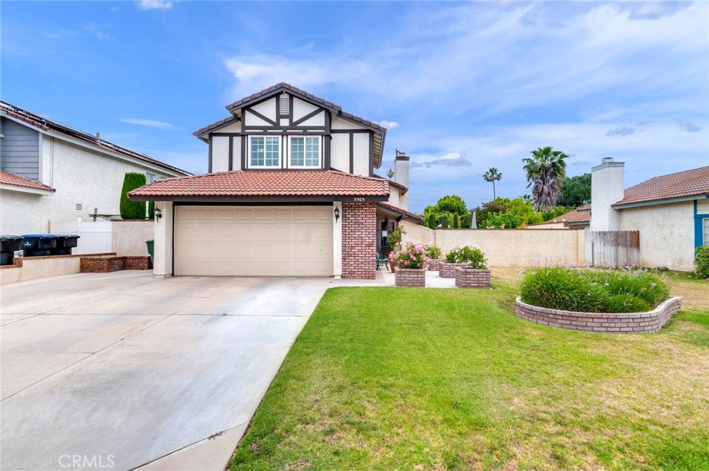 5505 Teaberry Road Riverside, CA 92505 - Photo 1 of 1 a front view of a house with a yard and garage