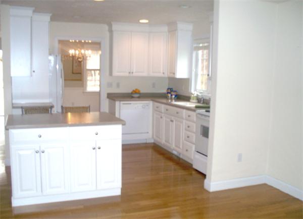 90 Summer Road, Unit 90 Boxborough, MA 01719 - Photo 3 of 10 a kitchen with stainless steel appliances granite countertop a sink and cabinets
