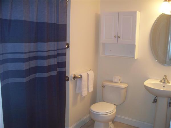90 Summer Road, Unit 90 Boxborough, MA 01719 - Photo 6 of 10 a bathroom with a toilet and a sink
