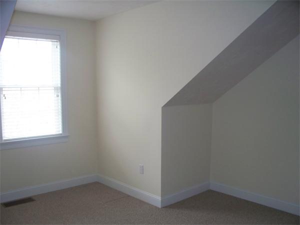 90 Summer Road, Unit 90 Boxborough, MA 01719 - Photo 9 of 10 an empty room with a window