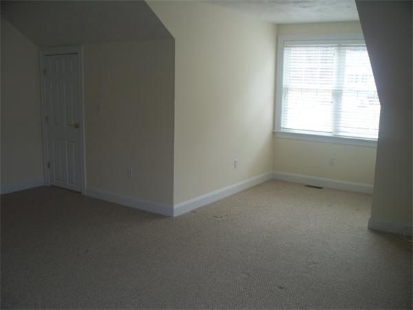 90 Summer Road, Unit 90 Boxborough, MA 01719 - Photo 10 of 10 an empty room with a window