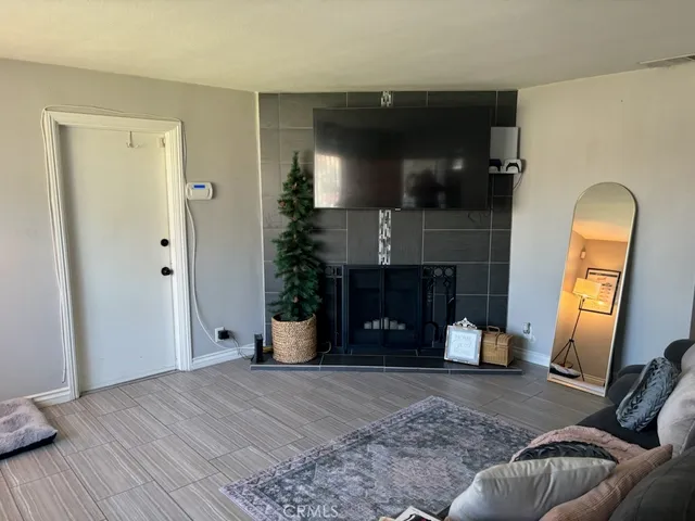 a view of a livingroom with furniture and a mirror