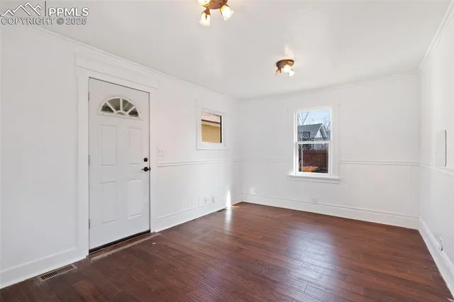a kitchen with stainless steel appliances a sink and cabinets