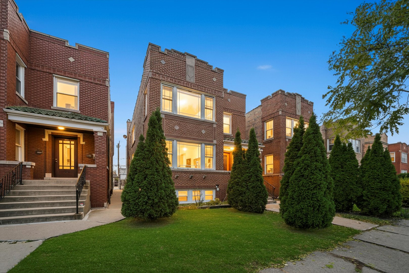 a front view of a house with a garden
