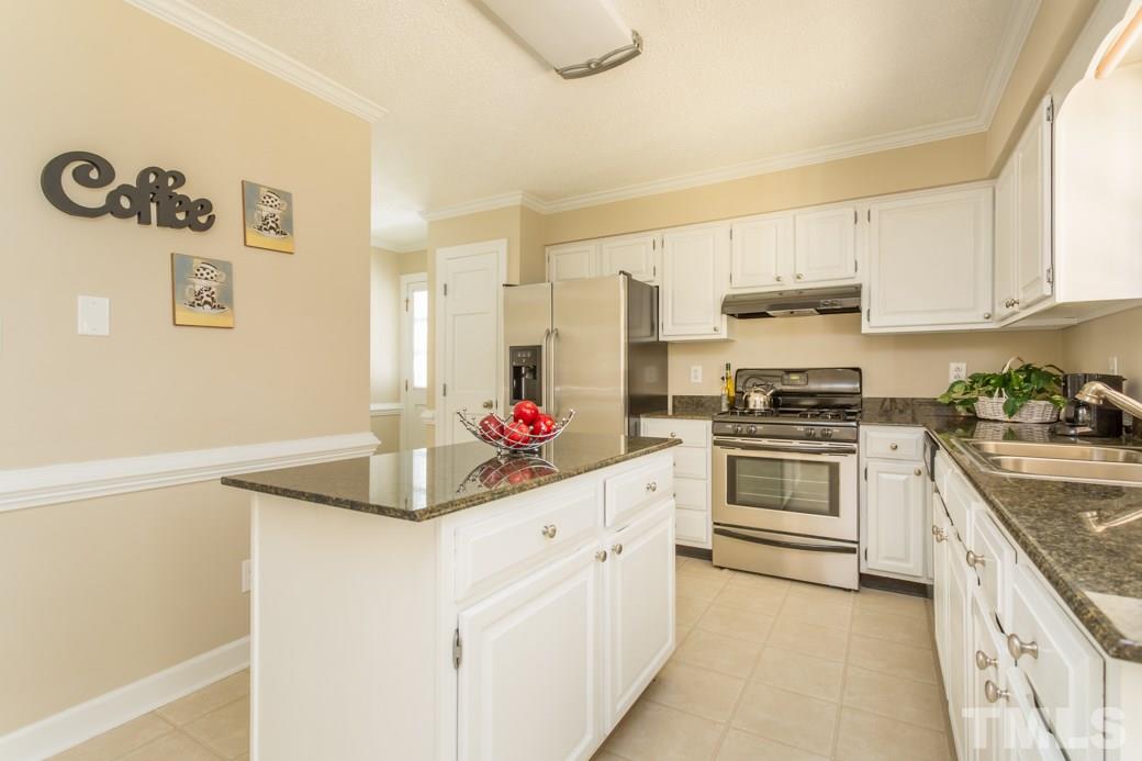 3600 East Jameson Road Raleigh, NC 27604 - Photo 2 of 15 a kitchen with granite countertop white cabinets and white appliances