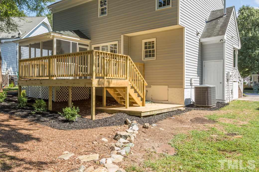 3600 East Jameson Road Raleigh, NC 27604 - Photo 14 of 15 a front view of a house with a yard and garage