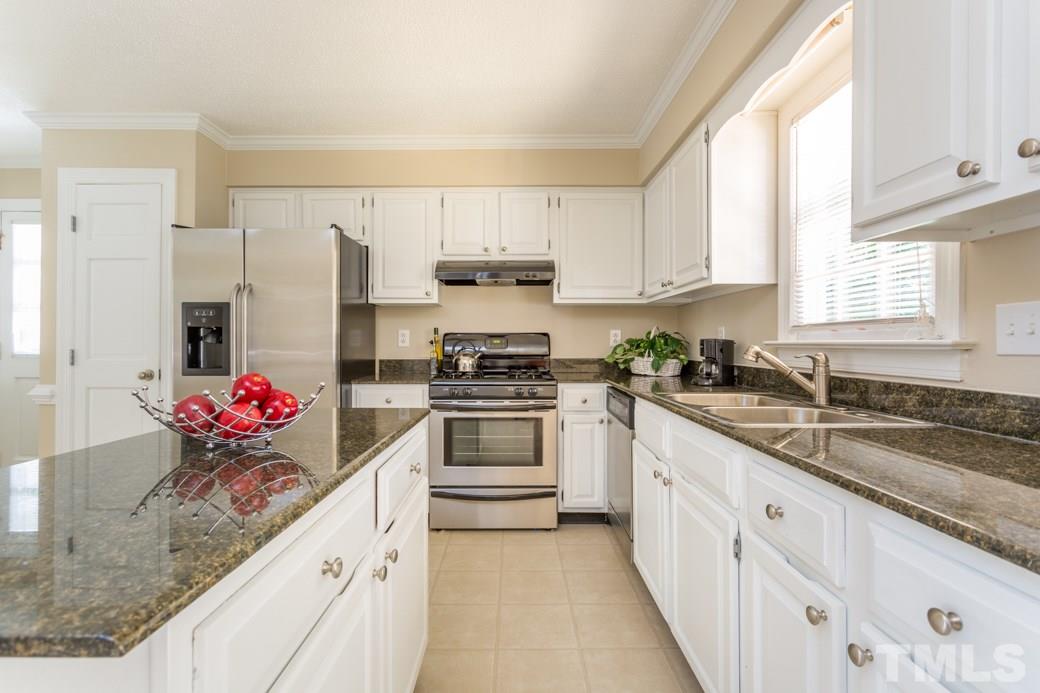 3600 East Jameson Road Raleigh, NC 27604 - Photo 3 of 15 a kitchen with stainless steel appliances granite countertop a sink stove and refrigerator