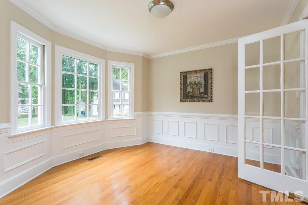 3600 East Jameson Road Raleigh, NC 27604 - Photo 5 of 15 a view of an empty room with a window and wooden floor