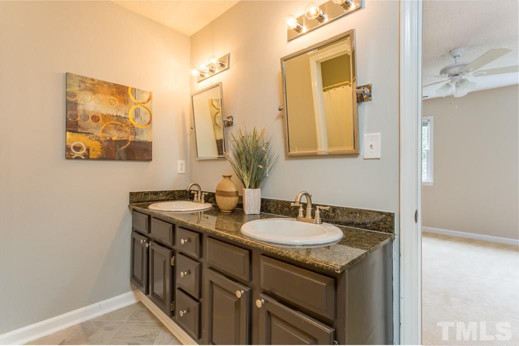 3600 East Jameson Road Raleigh, NC 27604 - Photo 9 of 15 a bathroom with a sink and a mirror